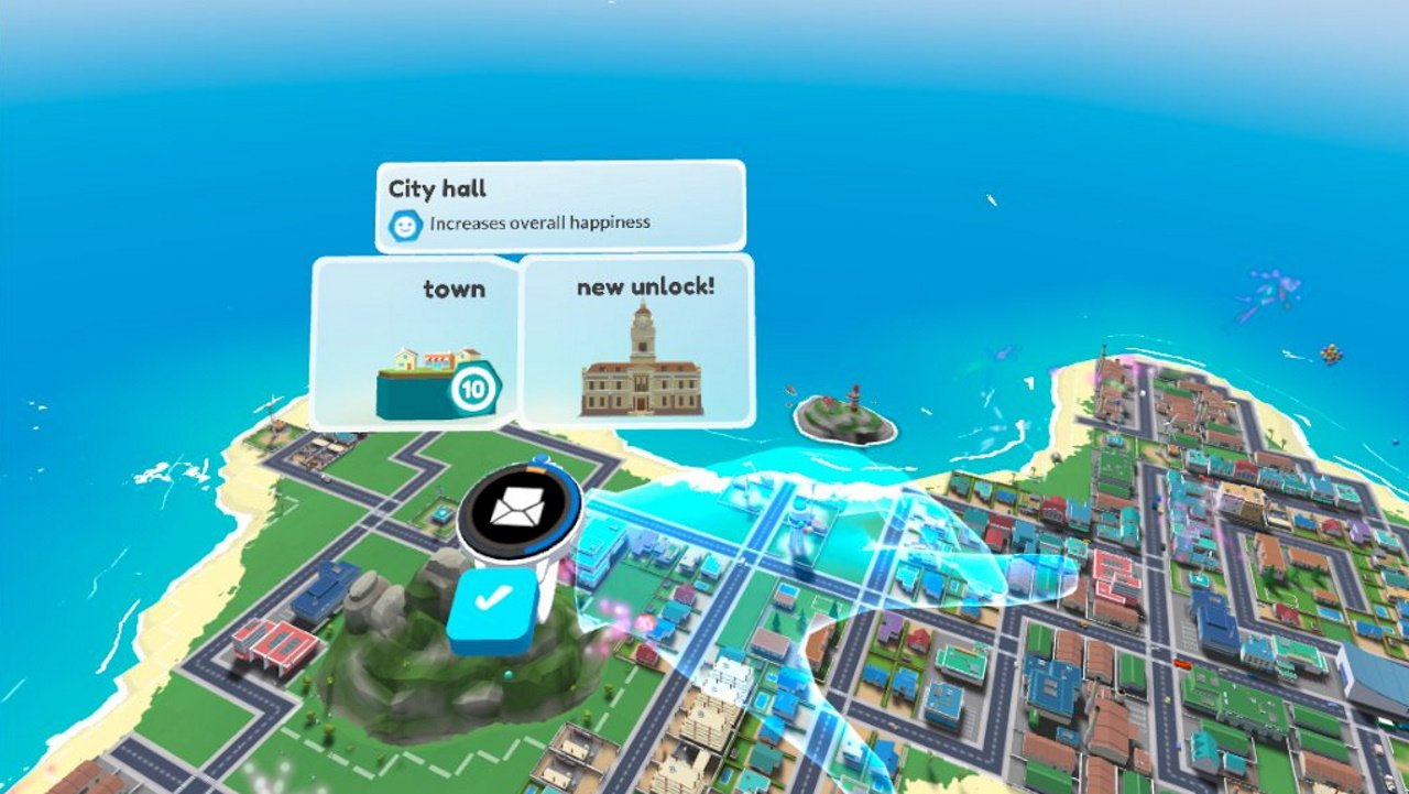 Little cities review vr city builder - an image of the players hands above a city, showing a new building has unlocked to build